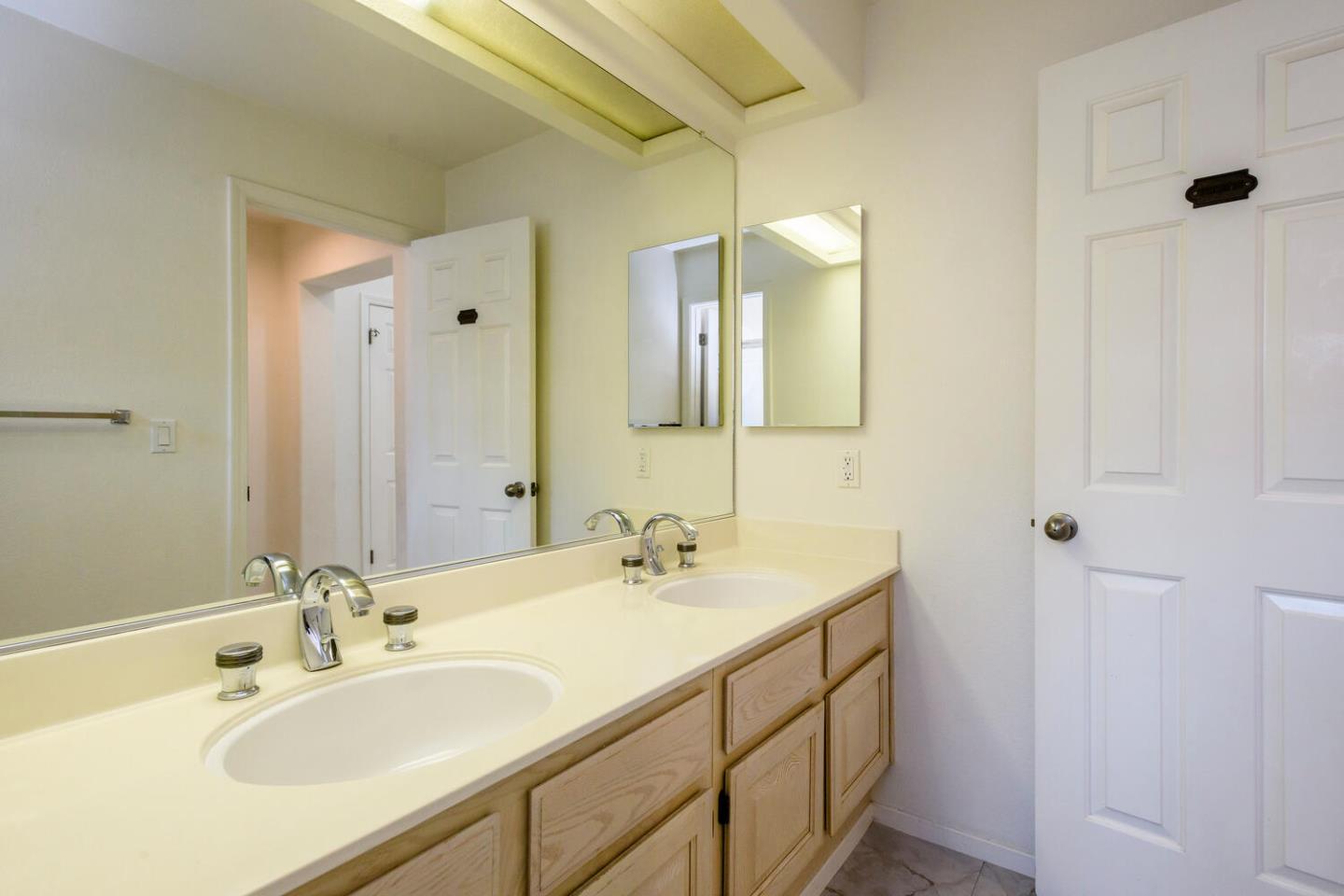 848 Columbia Circle Redwood City, CA 94065 - Photo 10 of 19 a bathroom with a sink and a mirror