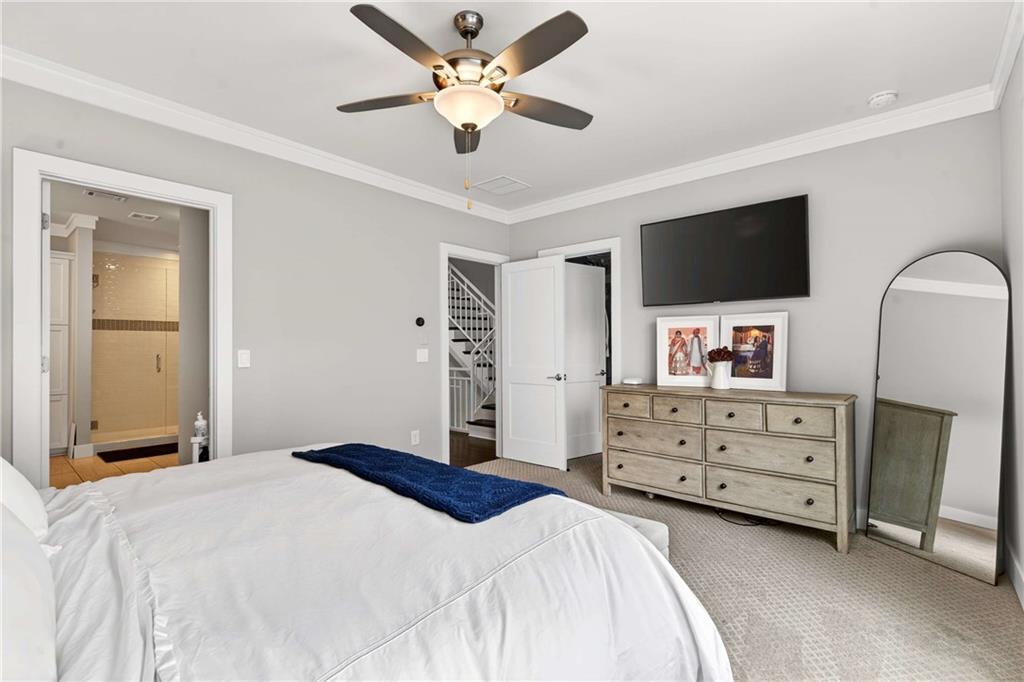 2974 Hermance Drive Northeast Atlanta, GA 30319 - Photo 16 of 38 a bedroom with a bed and a flat screen tv