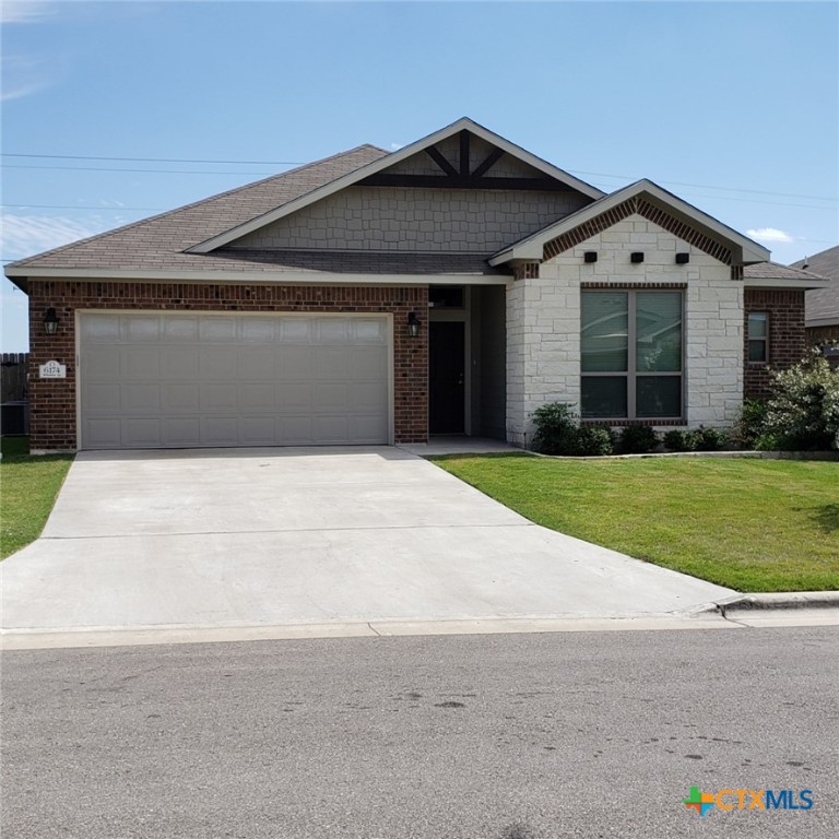 6174 Wheaton Loop Temple, TX 76502 - Photo 1 of 1 a front view of house with yard and green space