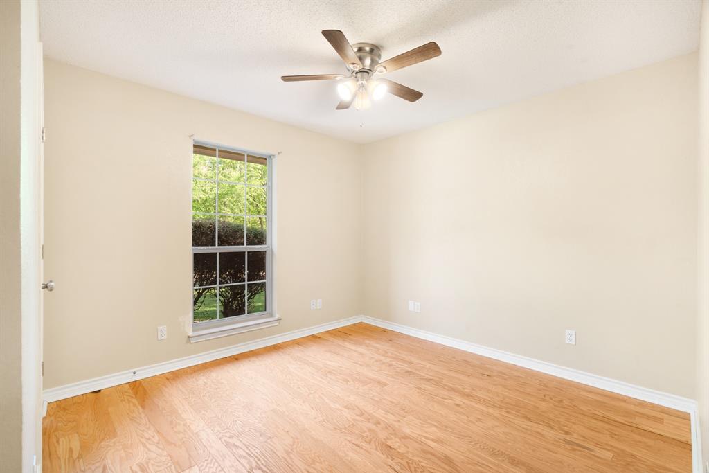 239 Deer Valley Drive Powderly, TX 75473 - Photo 12 of 18 an empty room with windows and fan
