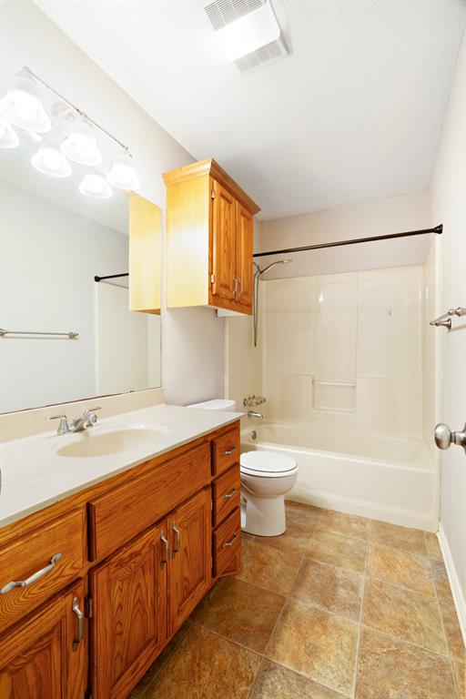 239 Deer Valley Drive Powderly, TX 75473 - Photo 13 of 18 a bathroom with a sink a toilet and shower