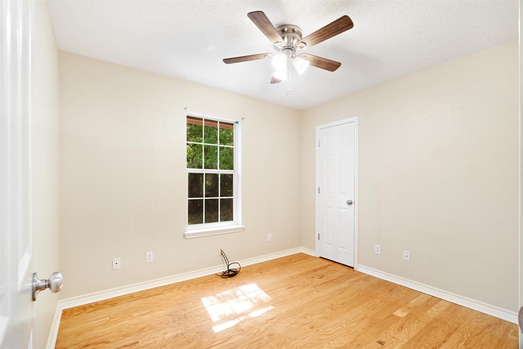 239 Deer Valley Drive Powderly, TX 75473 - Photo 14 of 18 an empty room with a window