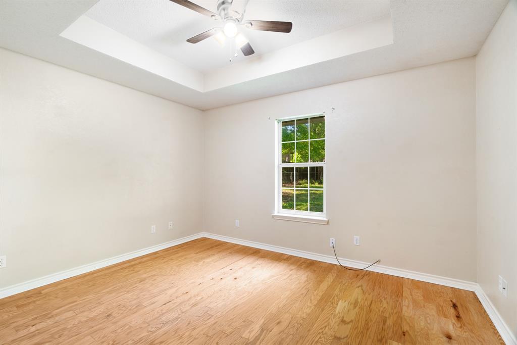 239 Deer Valley Drive Powderly, TX 75473 - Photo 15 of 18 an empty room with a empty space and windows