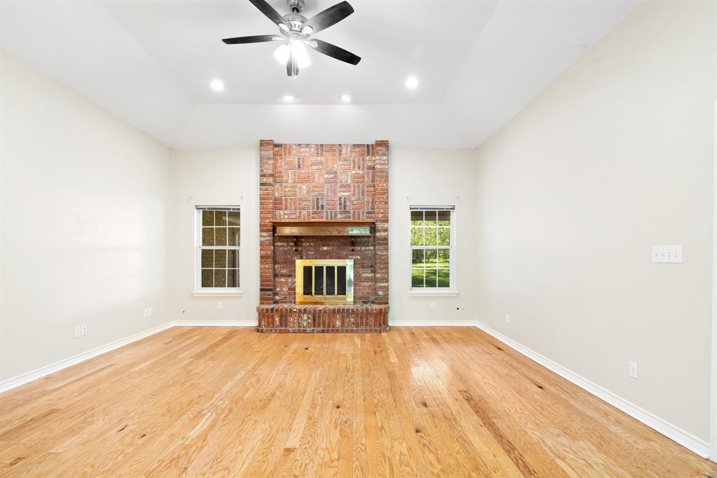 239 Deer Valley Drive Powderly, TX 75473 - Photo 2 of 18 a view of a livingroom with wooden floor