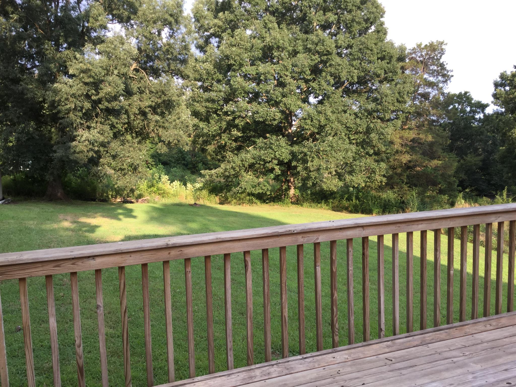 921 Hargrove Road West Dickson, TN 37055 - Photo 5 of 10 a view of a wooden deck and a yard