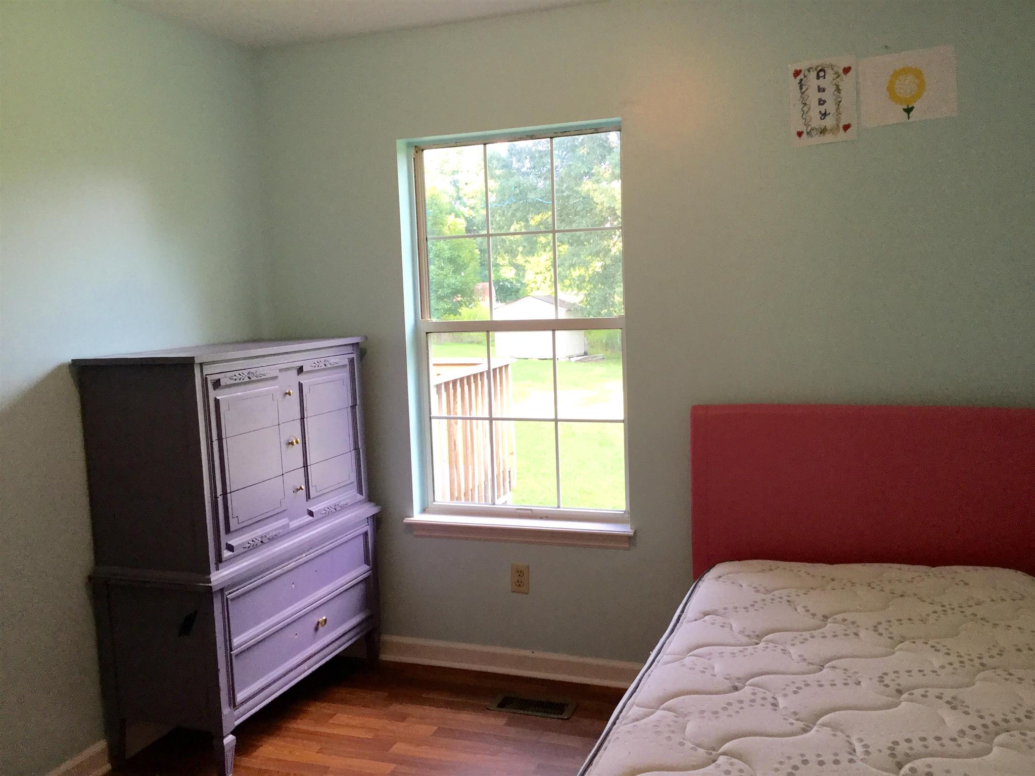 921 Hargrove Road West Dickson, TN 37055 - Photo 8 of 10 a bedroom with a bed and a window