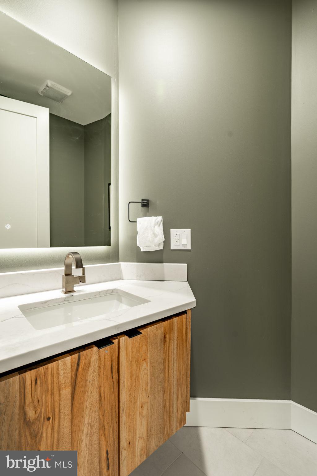 422 Mountaintop Road McHenry, MD 21541 - Photo 41 of 107 a bathroom with a sink and a mirror