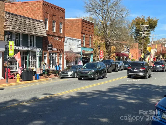 a view of a street with cars