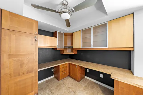 a kitchen with stainless steel appliances granite countertop a sink and a refrigerator