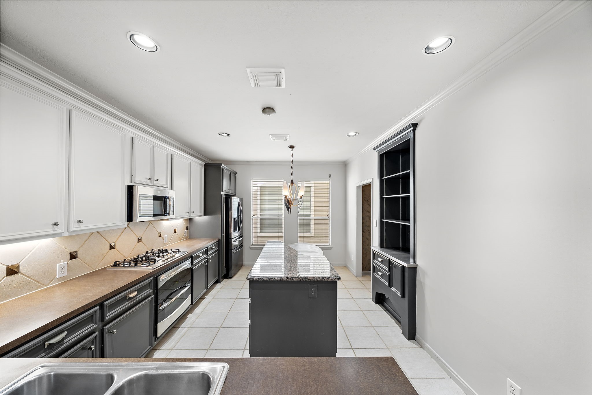 1429 Oneil Street Houston, TX 77019 - Photo 7 of 23 a kitchen with stainless steel appliances granite countertop a stove and cabinets