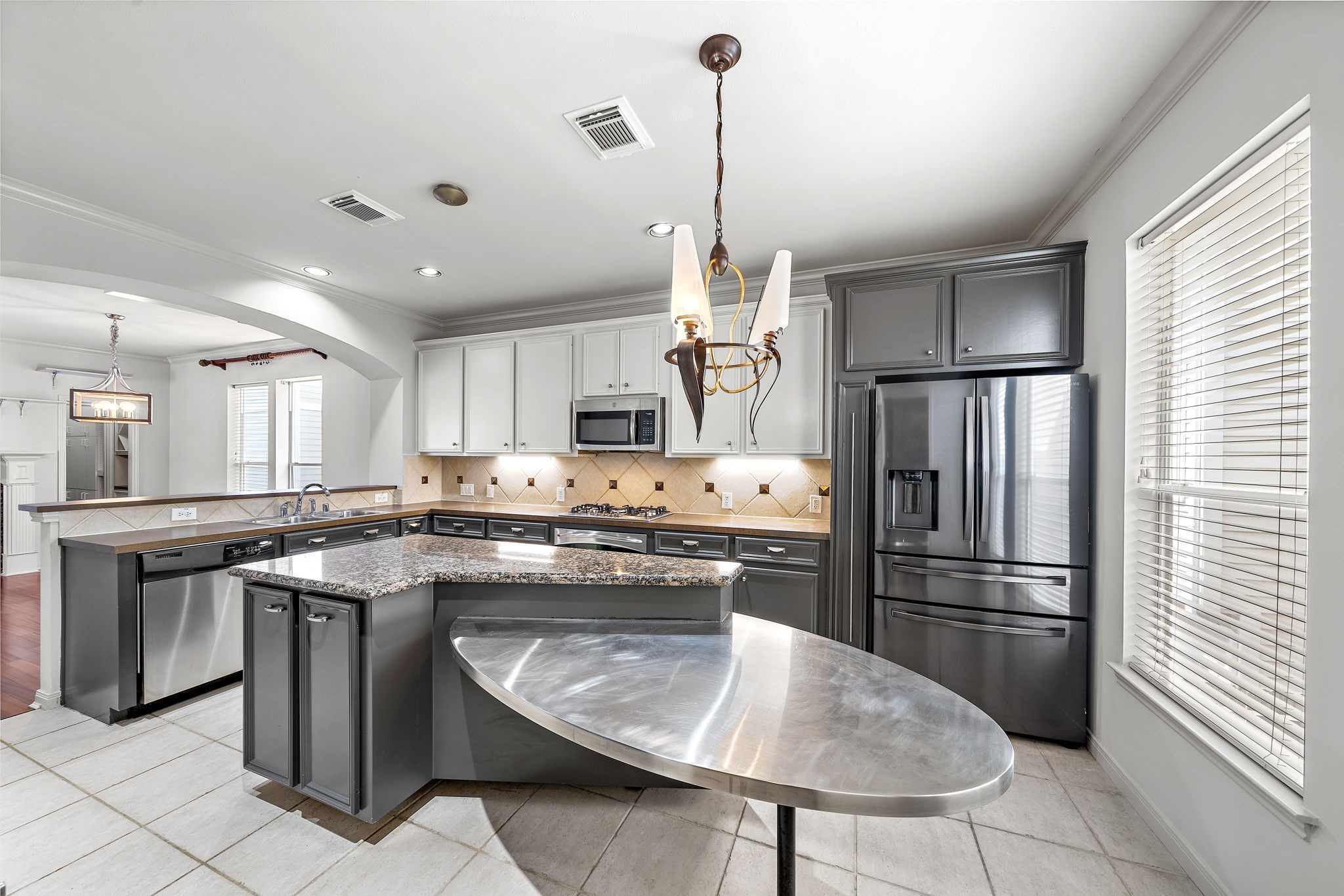 1429 Oneil Street Houston, TX 77019 - Photo 9 of 23 a kitchen with stainless steel appliances granite countertop a sink a stove a refrigerator and island