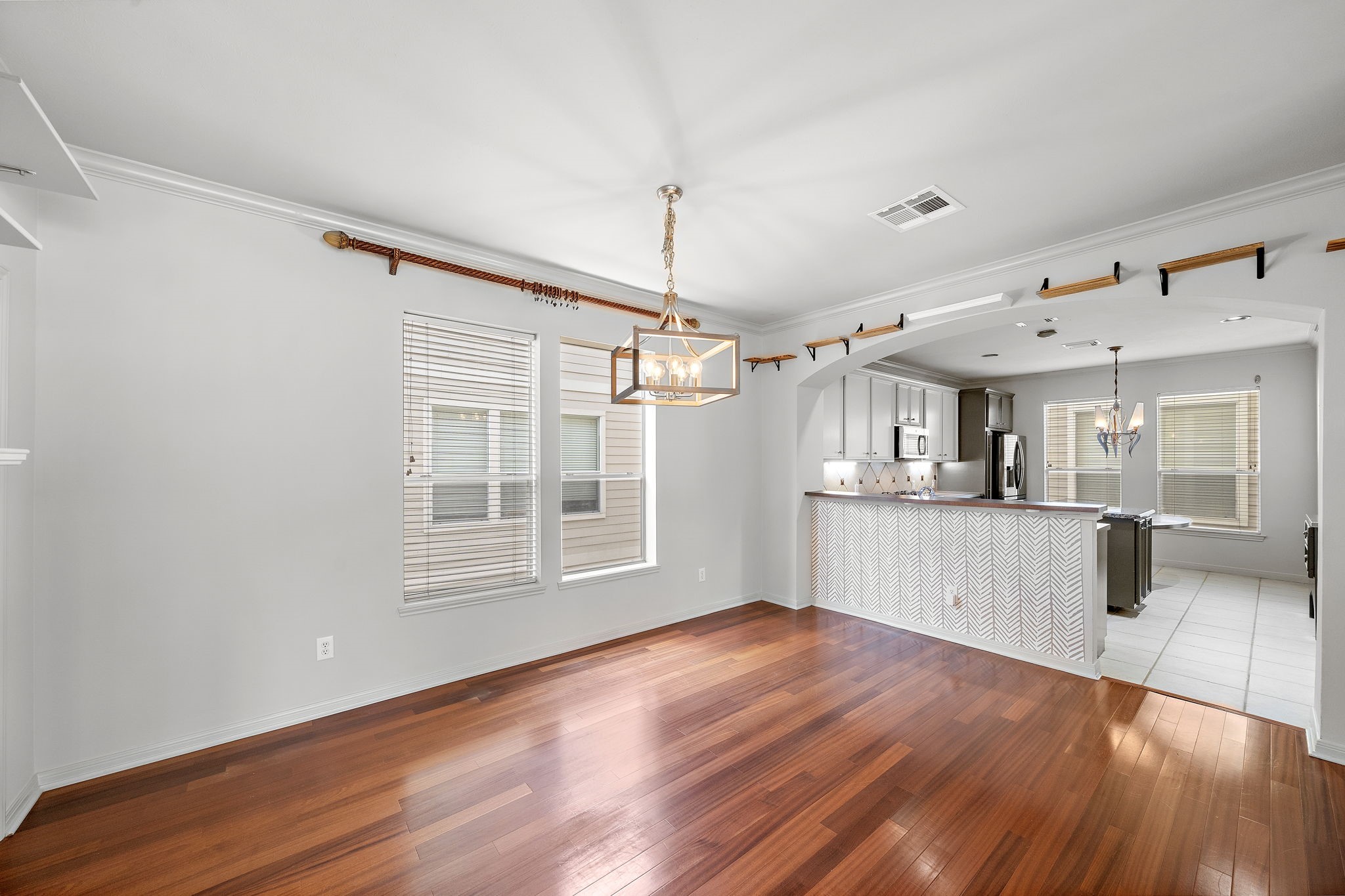 1429 Oneil Street Houston, TX 77019 - Photo 10 of 23 a view of a big room with wooden floor and windows