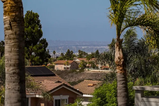 an aerial view of multiple houses with yard