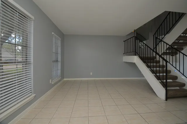 a view of a hallway with stairs