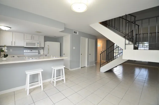 a view of kitchen with furniture and window