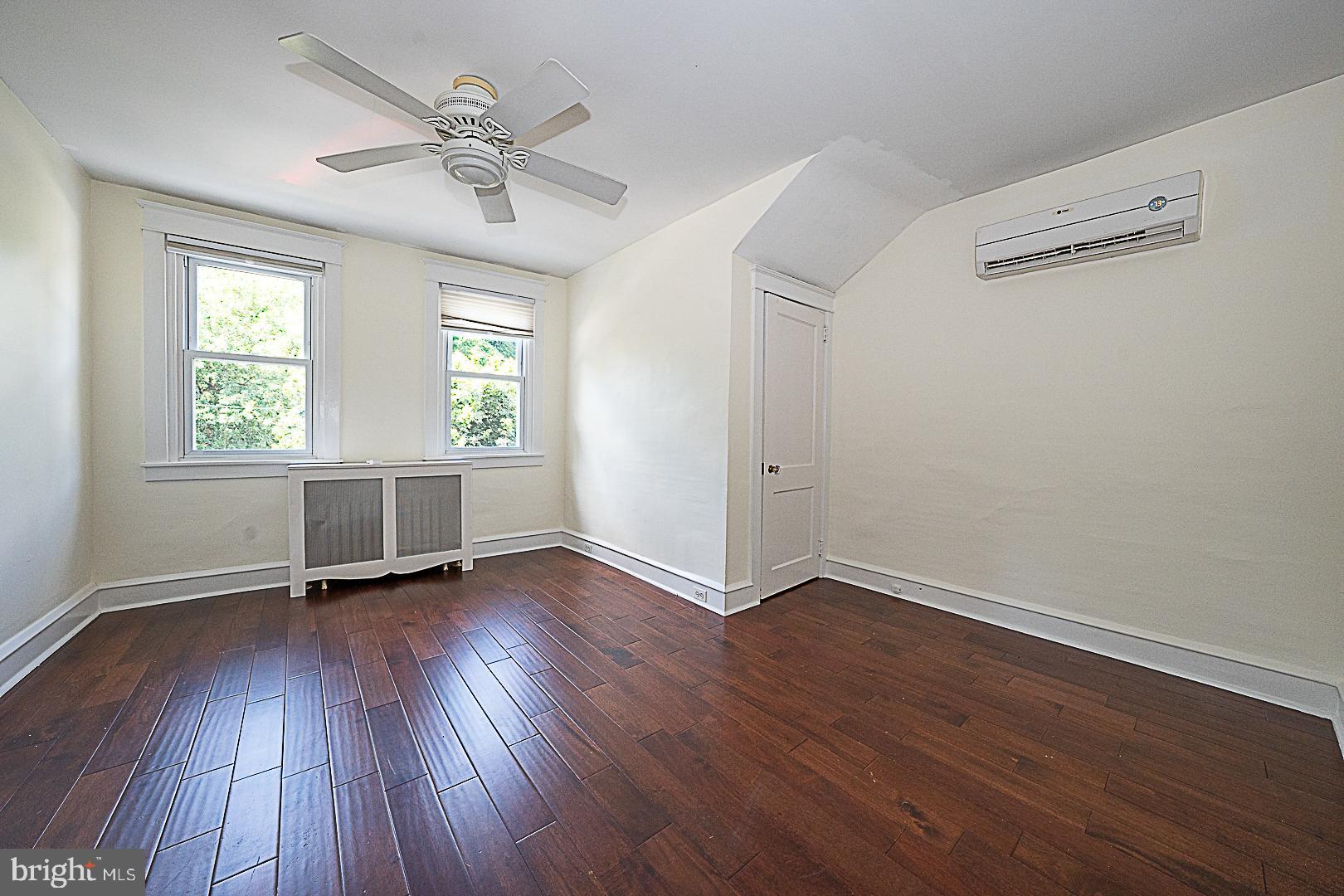 507 Homewood Avenue Narberth, PA 19072 - Photo 23 of 31 an empty room with wooden floor chandelier fan and windows