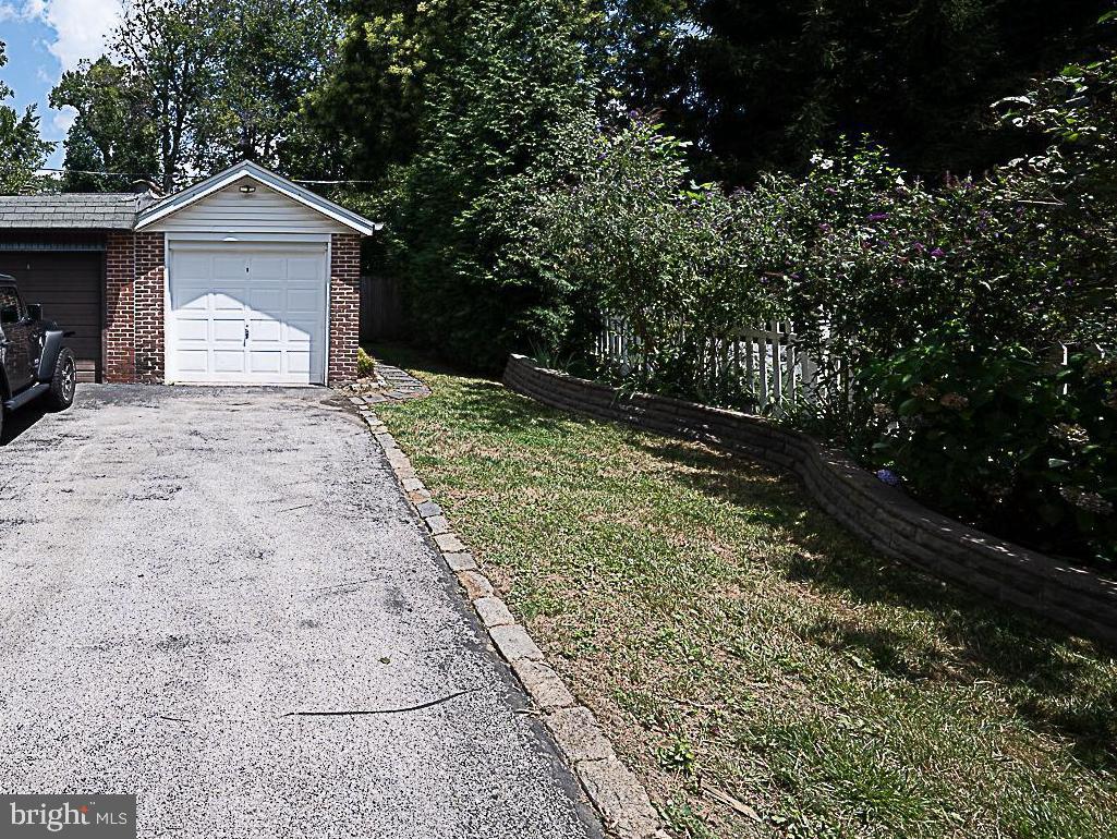507 Homewood Avenue Narberth, PA 19072 - Photo 29 of 31 a front view of a house with a yard and garage