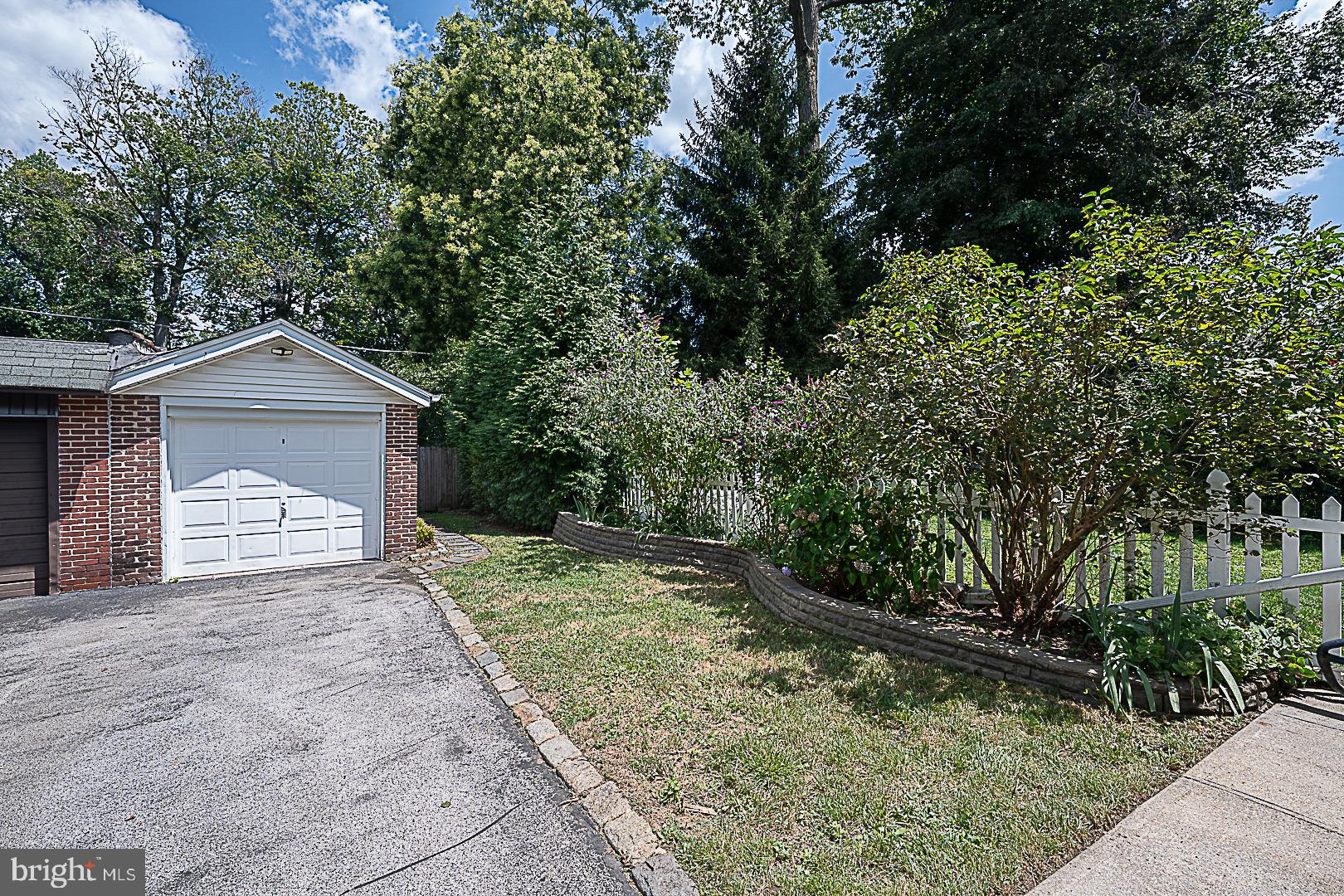 507 Homewood Avenue Narberth, PA 19072 - Photo 30 of 31 a front view of a house with a yard and garage