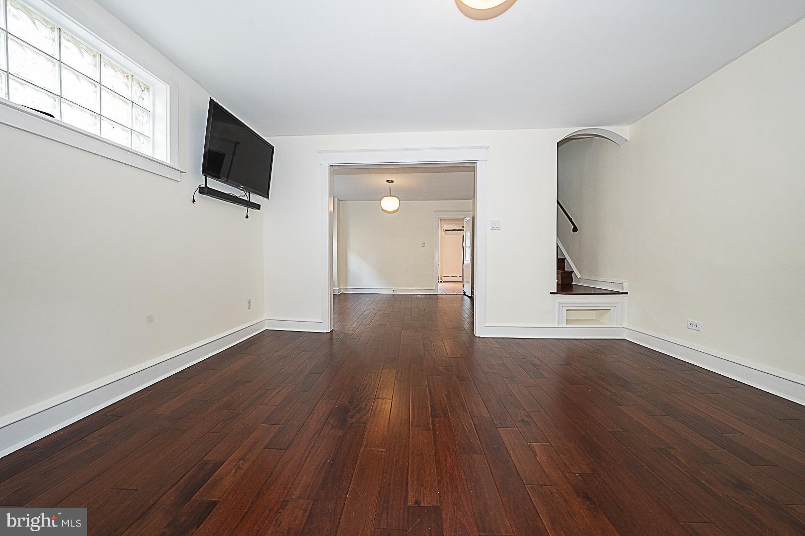 507 Homewood Avenue Narberth, PA 19072 - Photo 6 of 31 a view of a livingroom with wooden floor and a flat screen tv