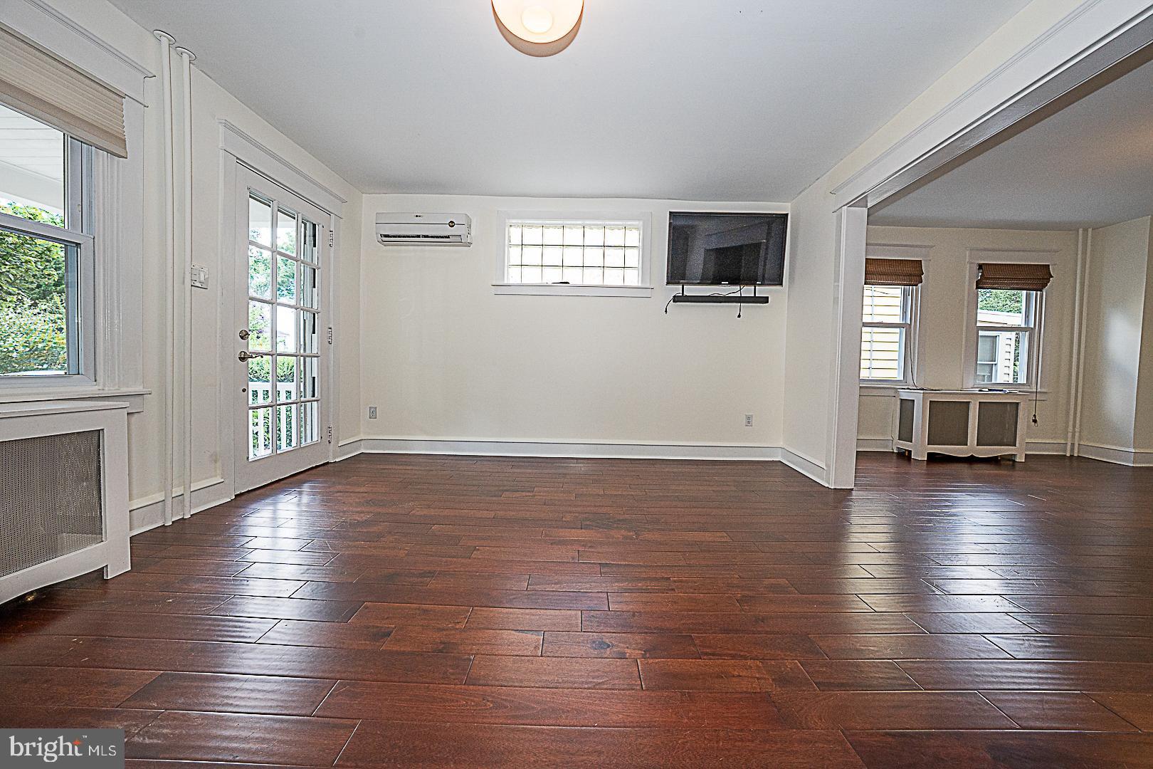 507 Homewood Avenue Narberth, PA 19072 - Photo 7 of 31 an empty room with wooden floor and windows