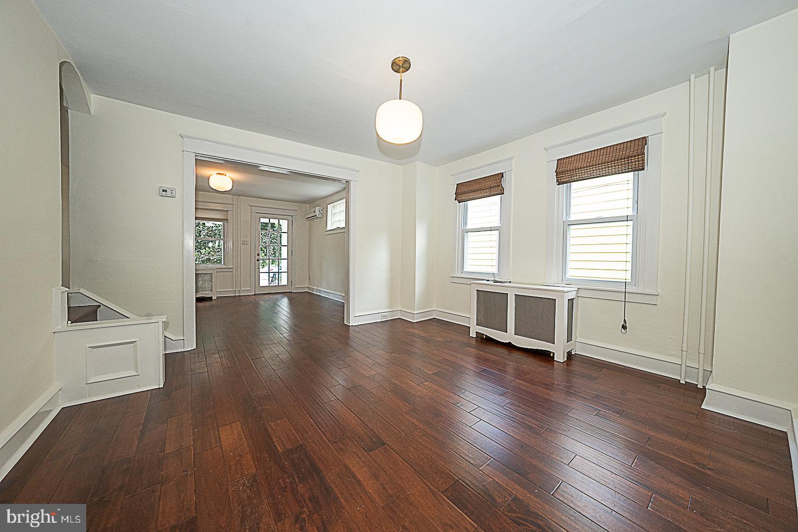 507 Homewood Avenue Narberth, PA 19072 - Photo 10 of 31 an empty room with wooden floor and windows
