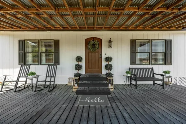 a front view of a house with wooden floor