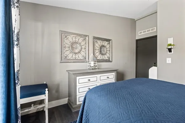 a bedroom with a bed and a desk