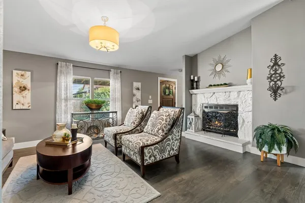 a living room with a couch and a fireplace