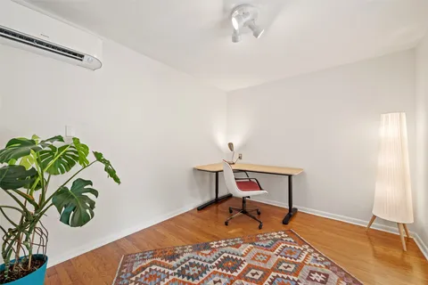 a view of a workspace with furniture