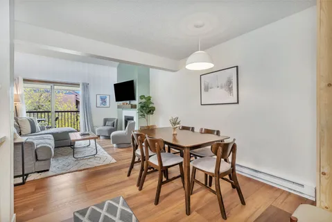 a view of a livingroom with furniture and a flat screen tv