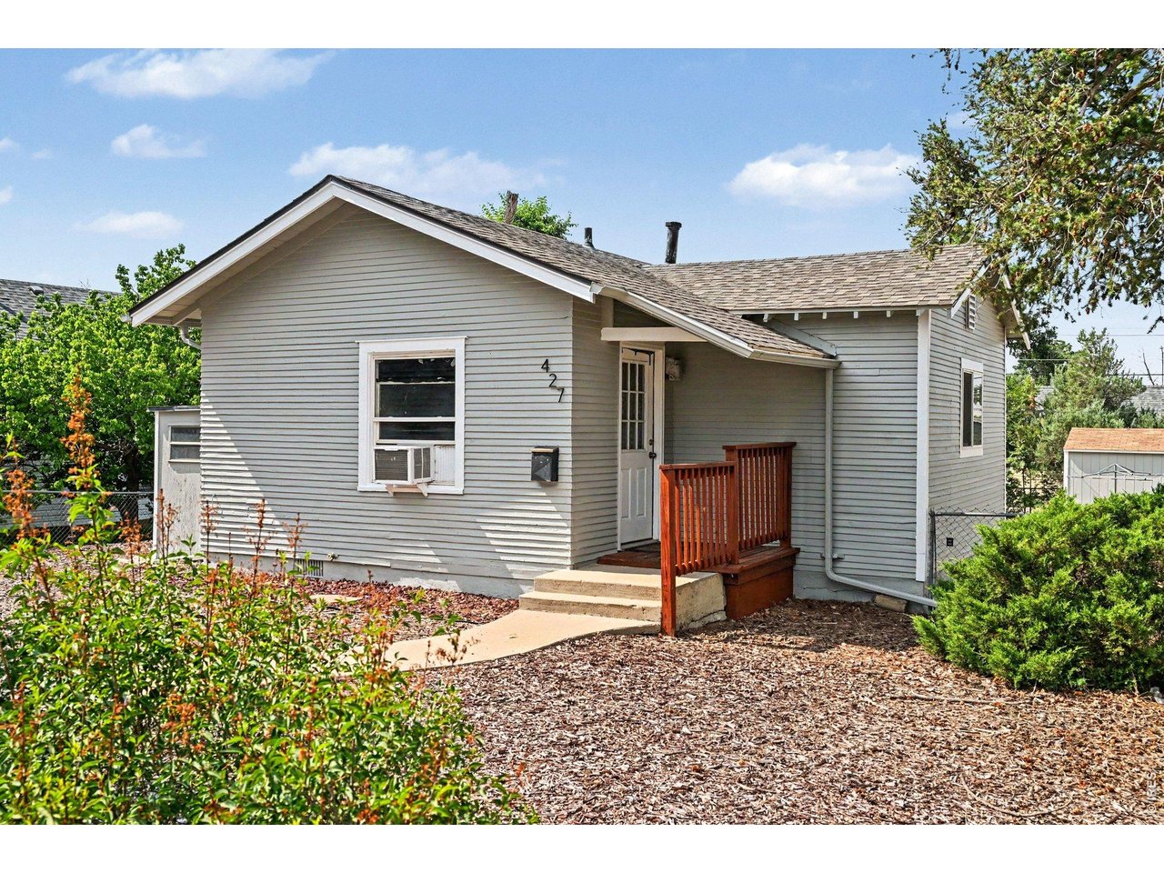427 9th Street Greeley, CO 80631 - Photo 8 of 22 a house view with a backyard space