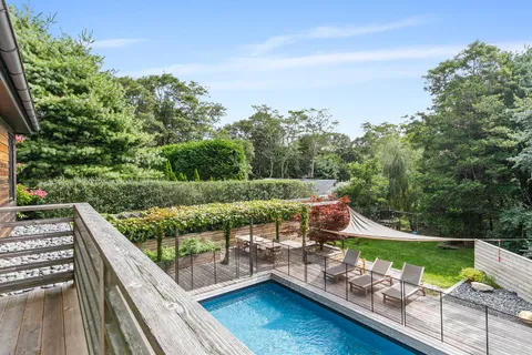 a view of a wooden deck with a patio