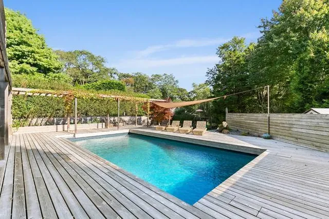 a view of a swimming pool with a patio