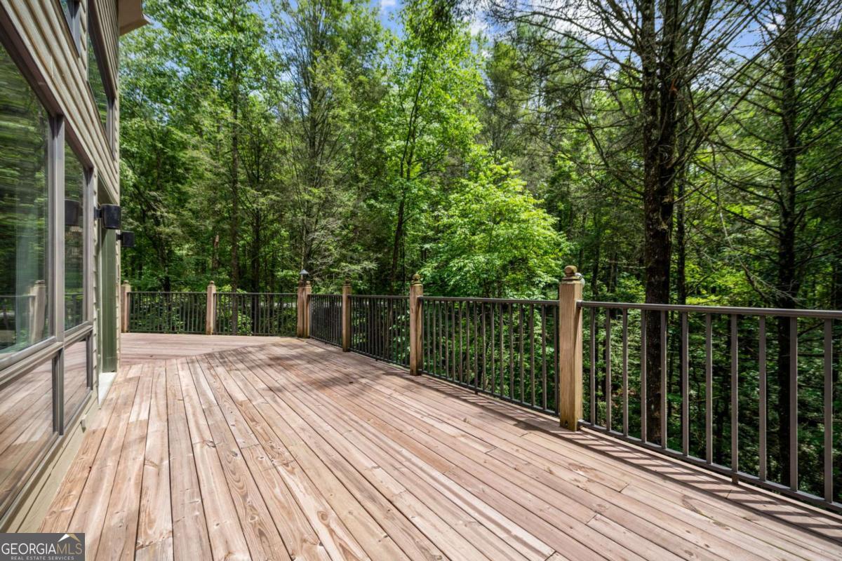 10323 Grassy Mountain Road Ellijay, GA 30540 - Photo 21 of 70 a view of backyard with a wooden deck