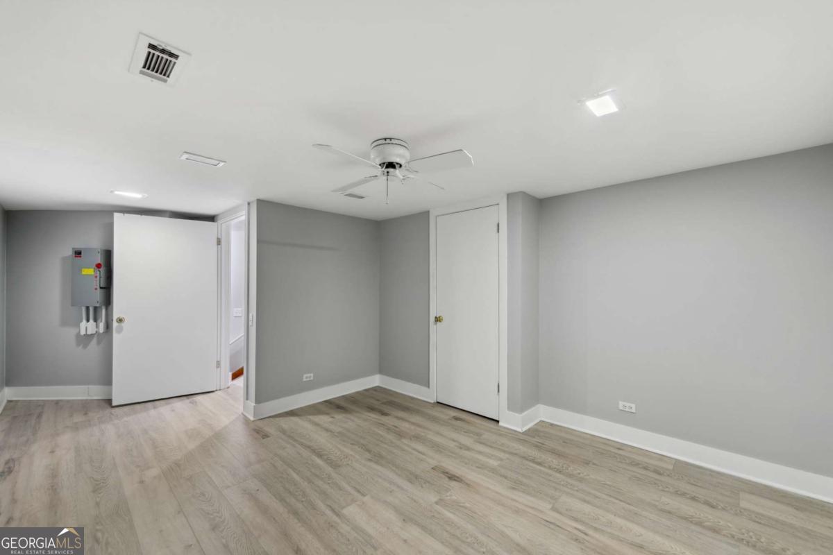 10323 Grassy Mountain Road Ellijay, GA 30540 - Photo 27 of 70 a view of an empty room with wooden floor