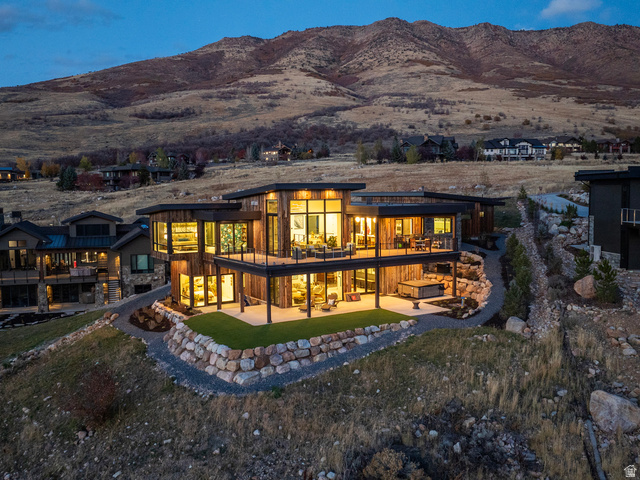 5731 Porcupine Ridge Drive Eden, UT 84310 - Photo 73 of 73 Rear view of house with a patio, a mountain view, and a lawn