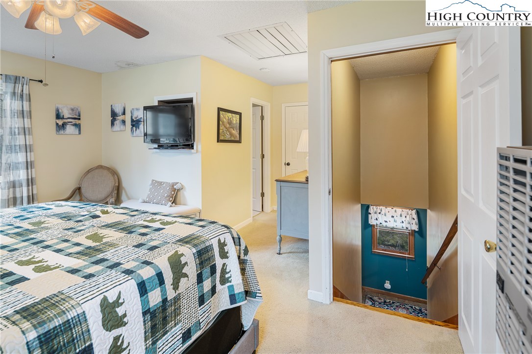 2408 Todd Railroad Grade Road Todd, NC 28684 - Photo 21 of 46 a bedroom with a bed and a television