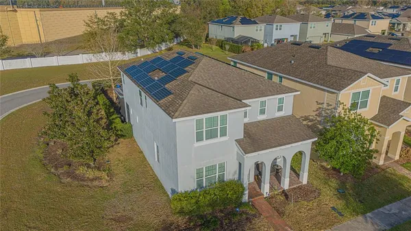 an aerial view of a house with a garden