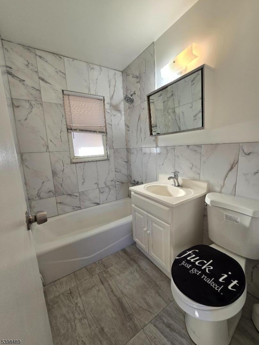 87 Elm Road, Unit 6A Caldwell, NJ 07006 - Photo 6 of 6 a bathroom with a sink a bathtub and a toilet