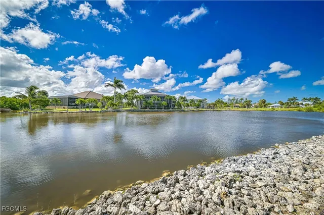 a view of a lake with a building in the background