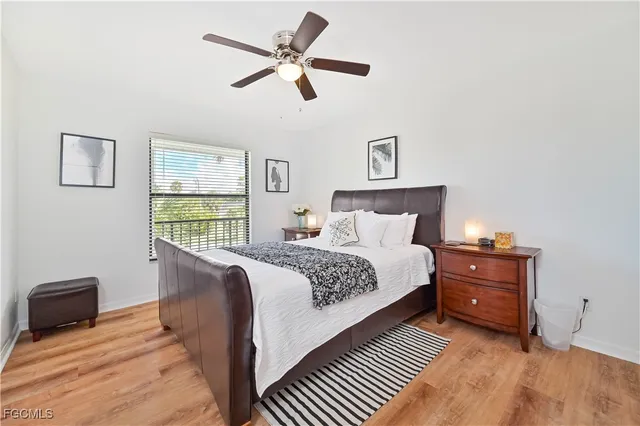 a bedroom with a bed and a tv