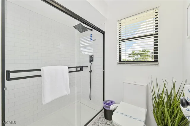 a dining room with a sink and chandelier
