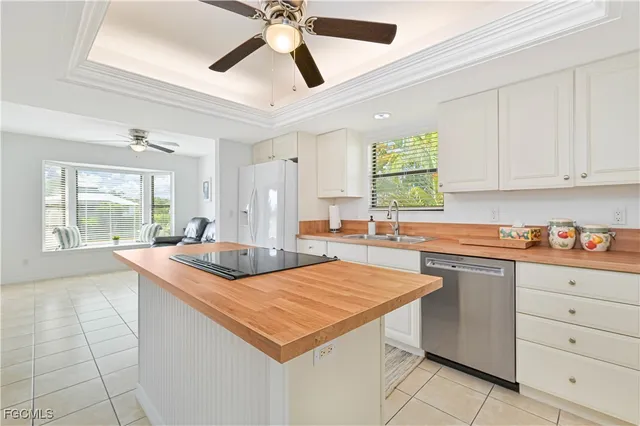 a room with furniture a clock and a view of dining room