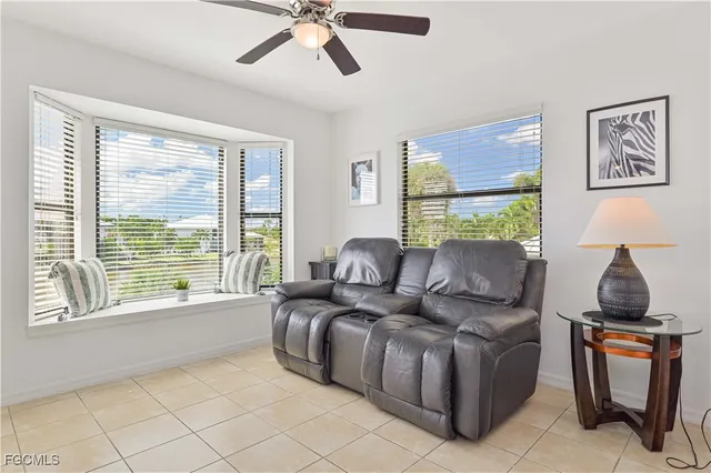 a living room with furniture a fireplace and a table