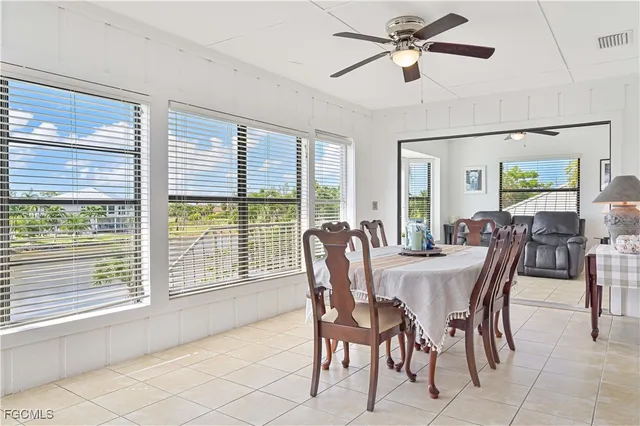 a bedroom with furniture and a large mirror