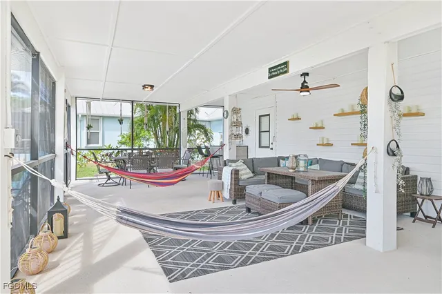 a room with lots of furniture and garden view