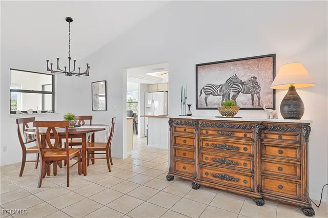 a view of dining room and hall with furniture