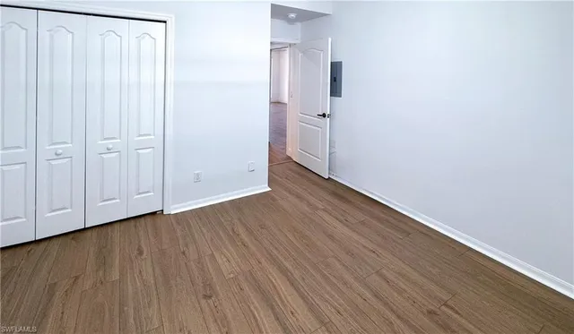 a view of hallway with wooden floor