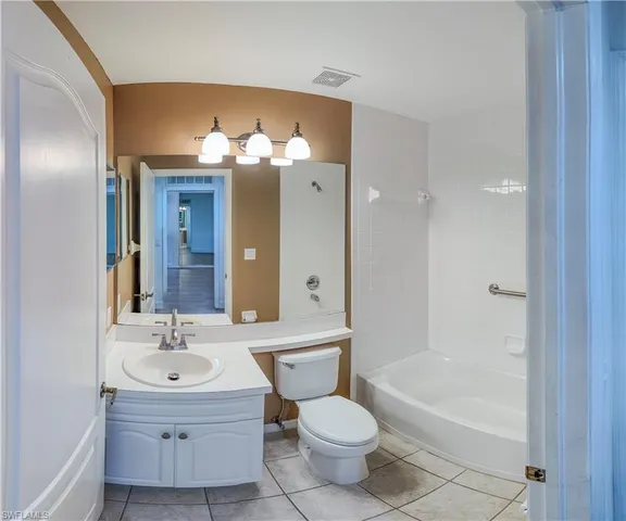 a bathroom with a sink a toilet and bathtub