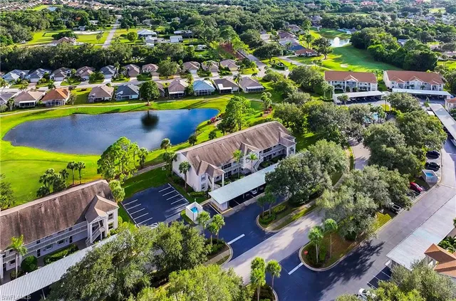an aerial view of a house with a swimming pool yard and outdoor seating